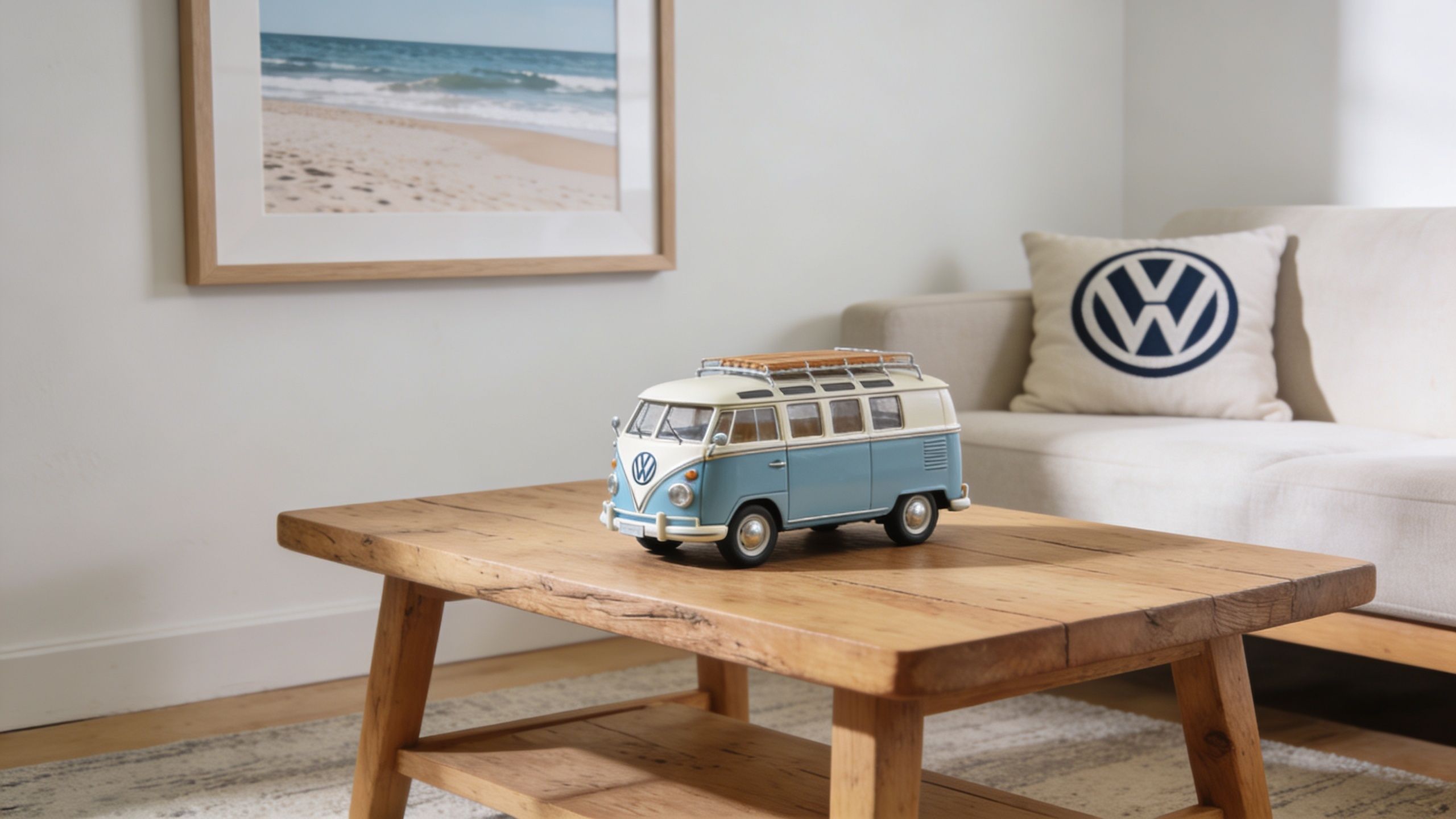 A miniature light blue and cream vintage Volkswagen camper van sits on a rustic wooden coffee table.