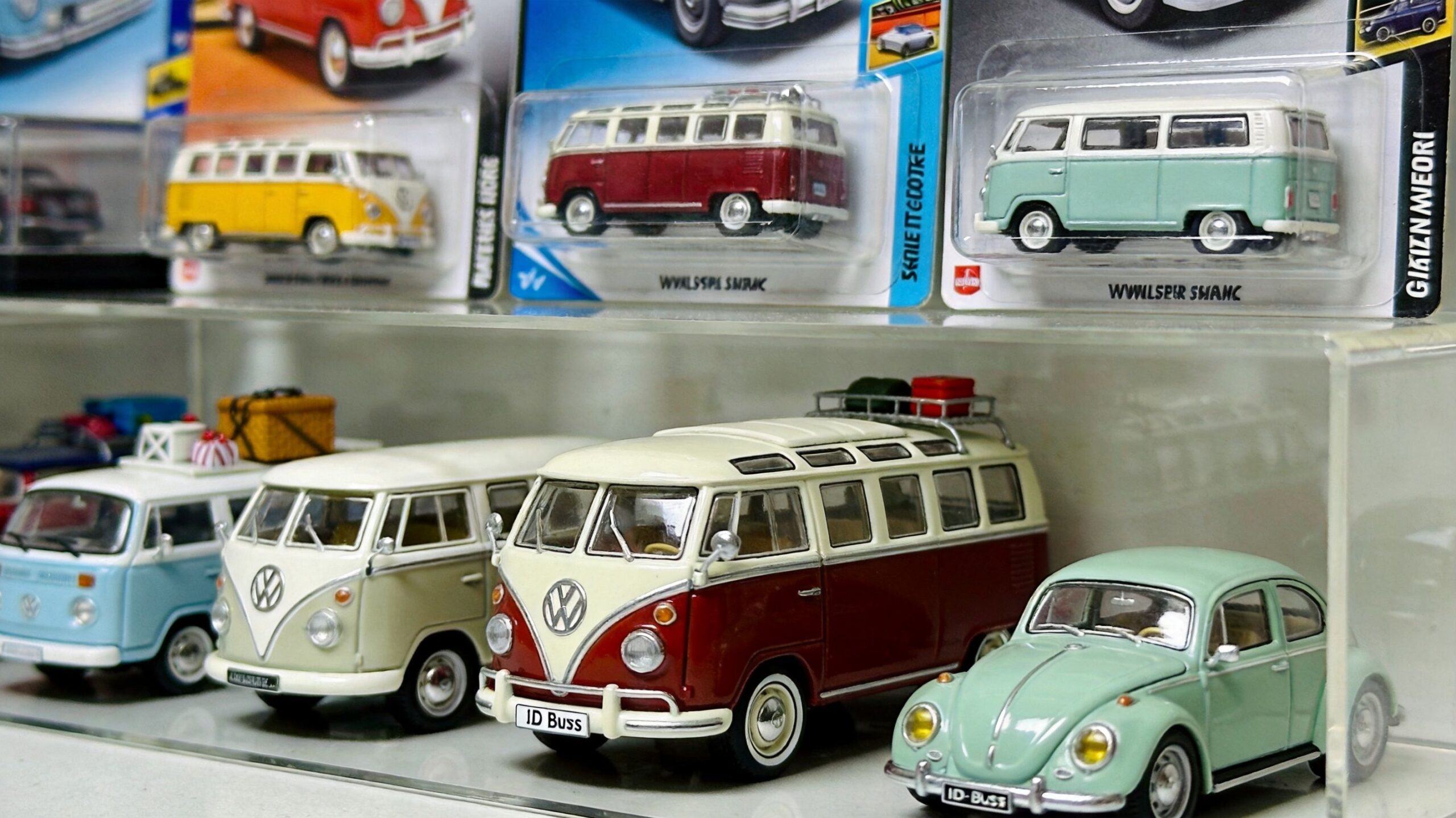 A collection of die-cast Volkswagen bus and beetle toy cars displayed on shelves.