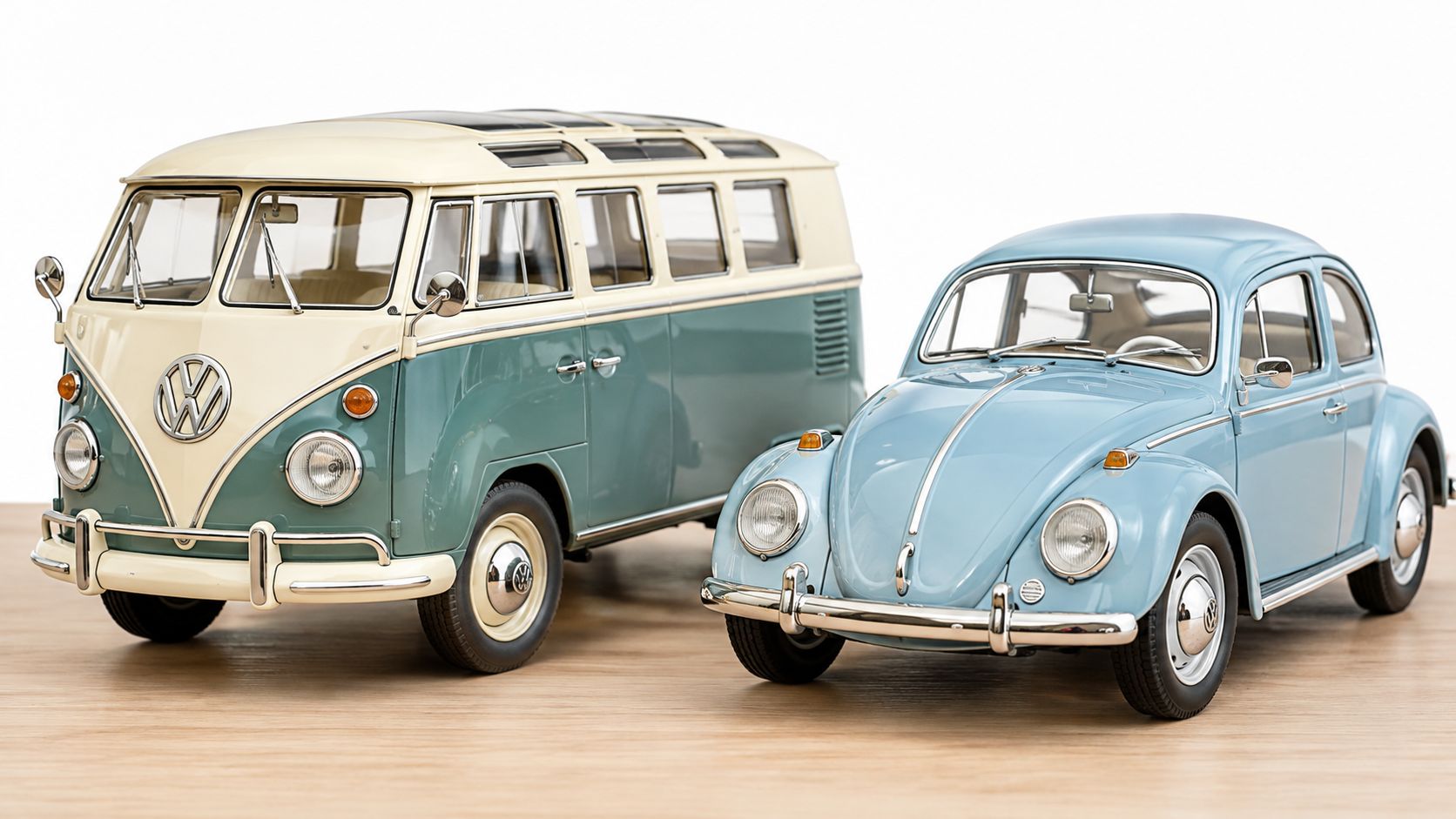 A miniature model of a vintage light blue Volkswagen Beetle next to a two-tone Volkswagen bus.