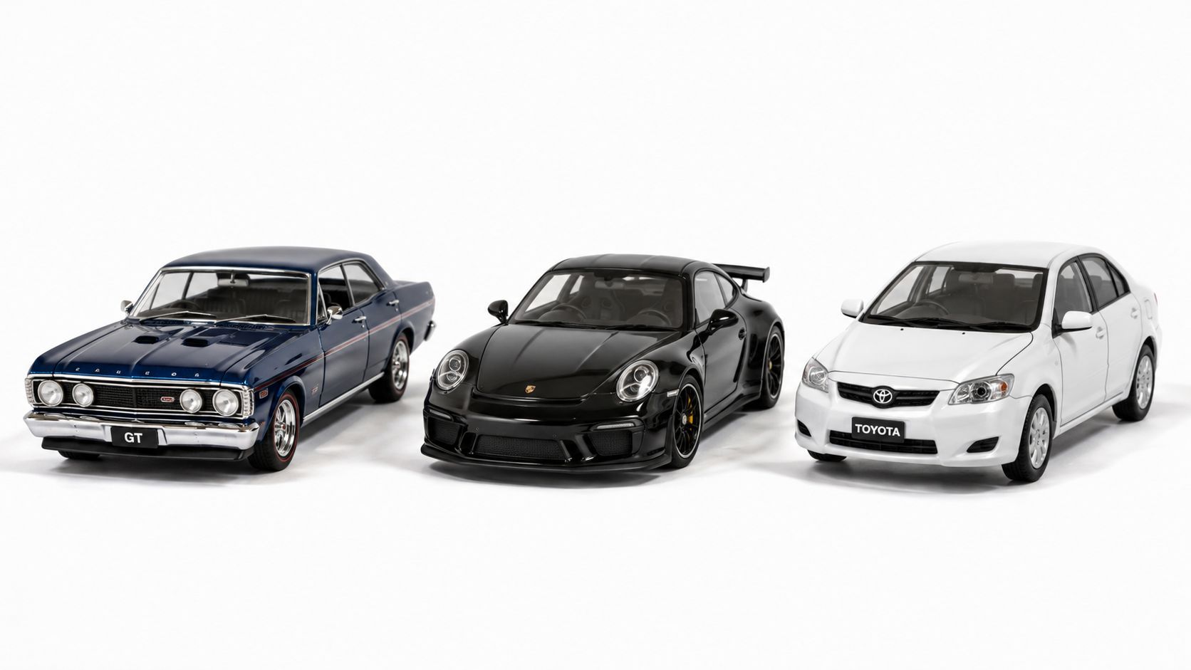 Three detailed collectible model cars including a blue sedan, black Porsche sports car, and white Toyota sedan.